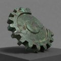 3D illusztráció egy korrodált bronz fogaskerék-töredékről, feliratozott rekonstrukció